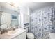 Bathroom with ample counter space and a blue and white floral shower curtain at 3137 Falling Cedars Dr, Chapel Hill, NC 27516