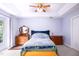 Comfortable bedroom featuring a tray ceiling, a large window, and a quaint aesthetic at 3137 Falling Cedars Dr, Chapel Hill, NC 27516