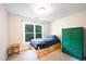 Cozy bedroom featuring built-in storage and a large window for natural light at 3137 Falling Cedars Dr, Chapel Hill, NC 27516