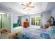 Comfortable bedroom featuring a tray ceiling, a large window, and an ensuite bathroom at 3137 Falling Cedars Dr, Chapel Hill, NC 27516
