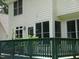 An image of the deck with a green wooden rail and various potted plants and bushes at 3137 Falling Cedars Dr, Chapel Hill, NC 27516