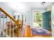 Inviting dining room with hardwood floors, bay window, and entryway with a storm door at 3137 Falling Cedars Dr, Chapel Hill, NC 27516
