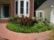 Landscaping at the front of the house featuring flowers and shrubbery at 3137 Falling Cedars Dr, Chapel Hill, NC 27516