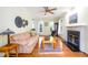 Inviting living room featuring hardwood floors, fireplace, and lots of natural light at 3137 Falling Cedars Dr, Chapel Hill, NC 27516