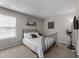Bedroom featuring a minimalist metal frame bed, wall art, carpet and a window with blinds at , Raleigh, NC 27610