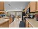 Open kitchen with modern appliances, ample counter space, and a view of the breakfast nook, creating a functional design at , Raleigh, NC 27610