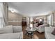 Bright living room featuring hardwood floors, a decorative coffee table, and comfortable seating, great for entertaining at , Raleigh, NC 27610