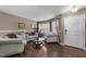Inviting living room with plush sofas, hardwood floors, and natural light streaming through the window, creating a cozy space at , Raleigh, NC 27610