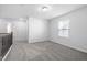 Upstairs bedroom featuring neutral walls, carpet, one window, and a view of the hall at 344 Bridle Brook Way, Fuquay Varina, NC 27526