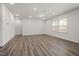 Spacious bonus room featuring wood flooring and ample natural light from large windows at 344 Bridle Brook Way, Fuquay Varina, NC 27526