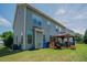 Wide backyard with a deck, gazebo, and lush green grass at 413 Barnard Castle Ct, Rolesville, NC 27571