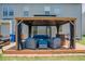Backyard patio area with outdoor lounge furniture, grill, and covered pergola at 413 Barnard Castle Ct, Rolesville, NC 27571