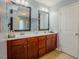 Bathroom with double vanity, modern fixtures, and neutral paint at 413 Barnard Castle Ct, Rolesville, NC 27571