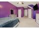 Purple bedroom featuring a large window and multiple closets at 413 Barnard Castle Ct, Rolesville, NC 27571