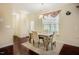 Cozy dining room features a chandelier over a four chair dining table at 413 Barnard Castle Ct, Rolesville, NC 27571