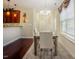 Cozy dining area featuring wood floors, wainscoting, and a stylish chandelier at 413 Barnard Castle Ct, Rolesville, NC 27571