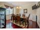 Dining room featuring a large window, an elegant chandelier, and a formal dining set at 413 Barnard Castle Ct, Rolesville, NC 27571