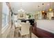 Inviting space with table, and a view into the living room at 413 Barnard Castle Ct, Rolesville, NC 27571