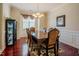 Dining room featuring a large window, an elegant chandelier, and a formal dining set at 413 Barnard Castle Ct, Rolesville, NC 27571