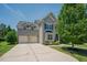 Spacious home with a two-car garage and a long driveway at 413 Barnard Castle Ct, Rolesville, NC 27571