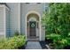 Inviting front door with a wreath and decorative 