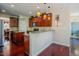 Open kitchen with stainless steel appliances, granite counters, and seamless flow to the living space at 413 Barnard Castle Ct, Rolesville, NC 27571