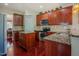 Kitchen with stainless steel appliances, granite countertops, and dark wood cabinetry at 413 Barnard Castle Ct, Rolesville, NC 27571