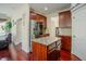 Modern kitchen featuring stainless steel appliances, granite countertops, and rich wood cabinetry at 413 Barnard Castle Ct, Rolesville, NC 27571