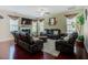 Inviting living room features a fireplace, ceiling fan, and comfortable leather seating arrangement at 413 Barnard Castle Ct, Rolesville, NC 27571