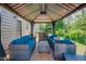 Outdoor lounge area features stylish wicker furniture and a covered pergola at 413 Barnard Castle Ct, Rolesville, NC 27571