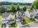 An aerial view of the property surrounded by mature trees in a neighborhood at 418 Wyndham Drive, Chapel Hill, NC 27516
