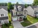 Aerial view of a two story home in a well manicured neighborhood at 418 Wyndham Drive, Chapel Hill, NC 27516