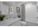Clean bathroom featuring a vanity with a sink, a shower-tub combination with a curtain, and neutral decor at 418 Wyndham Drive, Chapel Hill, NC 27516
