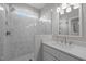Contemporary bathroom with marble enclosed shower, single vanity with granite counter and brushed nickel hardware at 418 Wyndham Drive, Chapel Hill, NC 27516