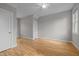 Well-lit bedroom featuring hardwood floors, neutral walls, a ceiling fan and natural light at 418 Wyndham Drive, Chapel Hill, NC 27516