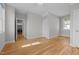 Bright bedroom with hardwood floors, neutral walls, closet and laundry room access at 418 Wyndham Drive, Chapel Hill, NC 27516