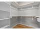 Spacious walk-in closet with shelving and hardwood floors at 418 Wyndham Drive, Chapel Hill, NC 27516