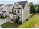 Exterior side view of a two-story home in a residential neighborhood at 418 Wyndham Drive, Chapel Hill, NC 27516