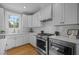 Bright kitchen with white cabinets, subway tile backsplash, and stainless steel appliances at 418 Wyndham Drive, Chapel Hill, NC 27516