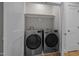 A modern laundry room with updated LG washer and dryer and ample shelving at 418 Wyndham Drive, Chapel Hill, NC 27516