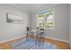 Bright office space with hardwood floors, a large window, and a modern desk with decor at 418 Wyndham Drive, Chapel Hill, NC 27516