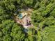 Overhead shot of the home's roof, surrounded by lush trees, pool, patios and long driveway at 4312 Mystic Ln, Hillsborough, NC 27278