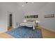 Bedroom boasts neutral colors, area rug, wood floors, and a modern ceiling fan at 4312 Mystic Ln, Hillsborough, NC 27278