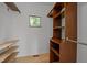 Bright walk-in closet features custom shelves and closet rod at 4312 Mystic Ln, Hillsborough, NC 27278