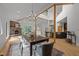 Elegant dining room with modern light fixture, hardwood floors, and adjacent living spaces at 4312 Mystic Ln, Hillsborough, NC 27278