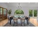 Formal dining room with hardwood floors, chairs, and ample natural light at 4312 Mystic Ln, Hillsborough, NC 27278