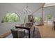 Bright dining room featuring hardwood floors and natural light coming from a picture window at 4312 Mystic Ln, Hillsborough, NC 27278