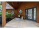 Inviting entryway featuring a covered porch, outdoor seating, and a stylish front door at 4312 Mystic Ln, Hillsborough, NC 27278