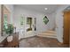 Bright foyer featuring tile floors, staircase, and a view to the exterior through glass paneled doors at 4312 Mystic Ln, Hillsborough, NC 27278