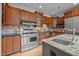 Well-equipped kitchen with stainless steel appliances and wooden cabinets at 4312 Mystic Ln, Hillsborough, NC 27278